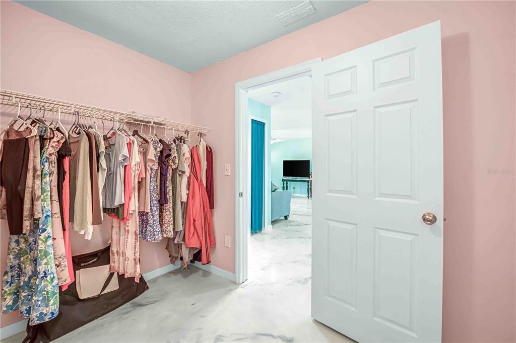 3379 Crape Myrtle Drive Hernando Beach, FL 34607 - Photo 27 of 68 a view of walk in closet with clothes