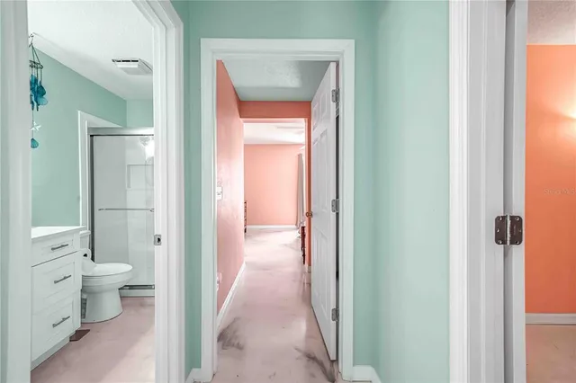 a kitchen with stainless steel appliances kitchen island granite countertop a refrigerator and a stove top oven