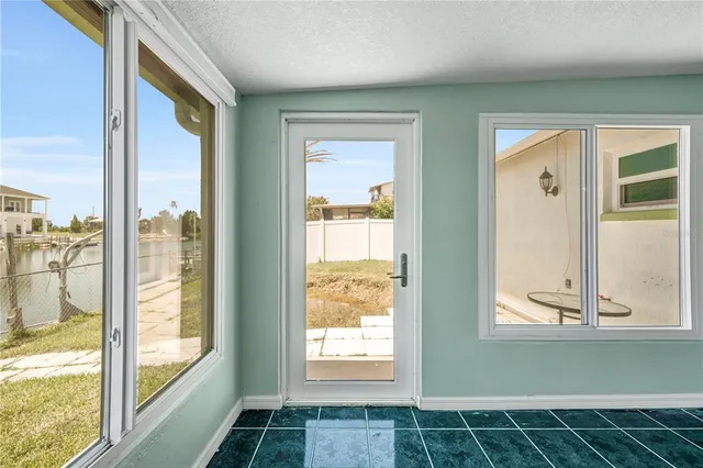 a view of a livingroom with furniture and a chandelier fan