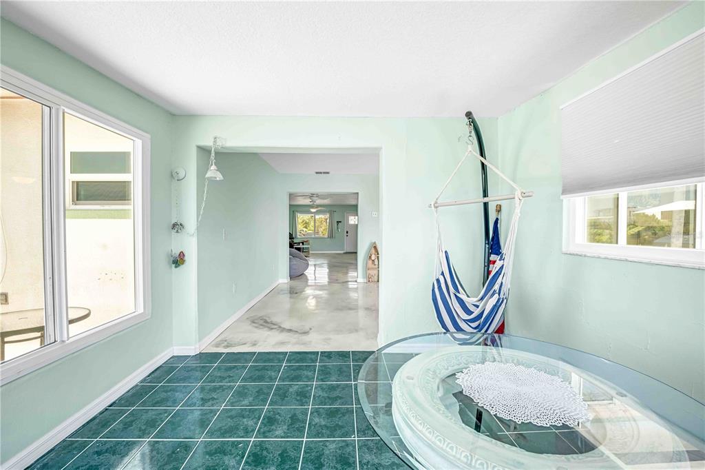 3379 Crape Myrtle Drive Hernando Beach, FL 34607 - Photo 32 of 68 a room with toys and wooden floor