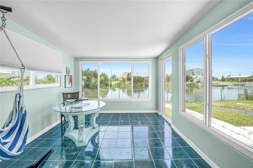 3379 Crape Myrtle Drive Hernando Beach, FL 34607 - Photo 34 of 68 a view of a room with a furniture and floor to ceiling window