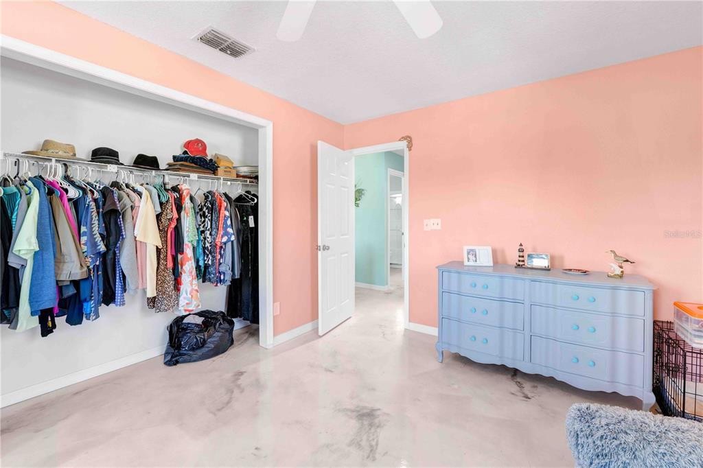 3379 Crape Myrtle Drive Hernando Beach, FL 34607 - Photo 49 of 68 a view of walk in closet with clothes