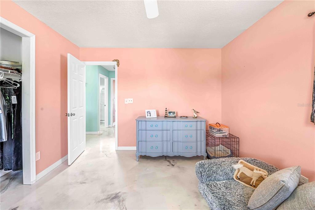 3379 Crape Myrtle Drive Hernando Beach, FL 34607 - Photo 50 of 68 a living room with furniture and a bed