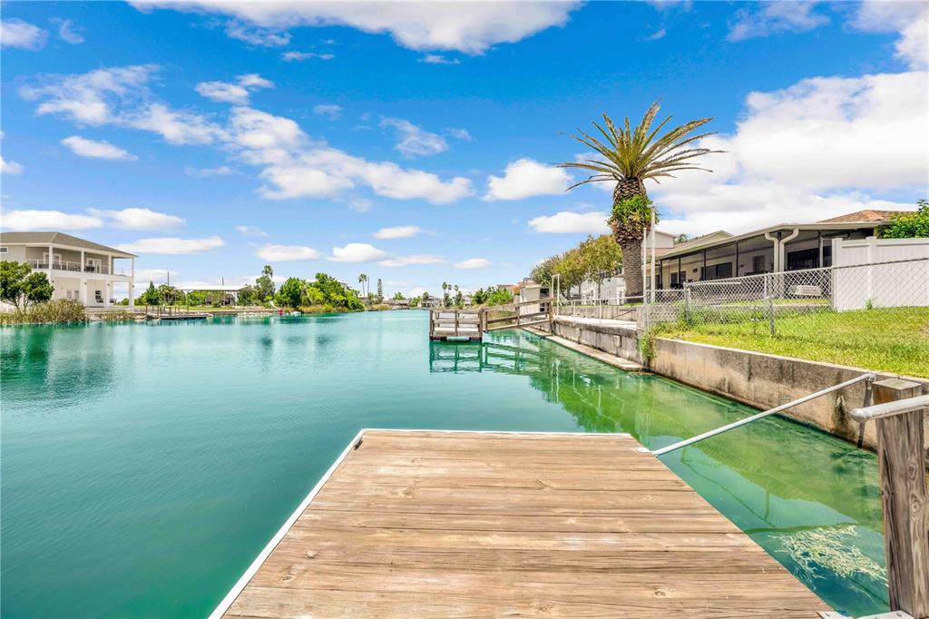 3379 Crape Myrtle Drive Hernando Beach, FL 34607 - Photo 54 of 68 a view of a lake with a yard