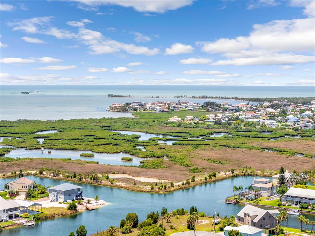 3379 Crape Myrtle Drive Hernando Beach, FL 34607 - Photo 64 of 68 an aerial view of ocean and residential houses with outdoor space