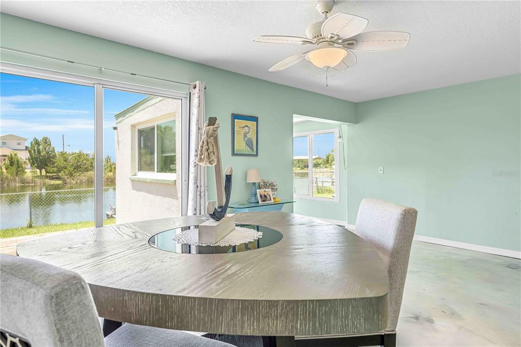 3379 Crape Myrtle Drive Hernando Beach, FL 34607 - Photo 8 of 68 a dining room with furniture and window