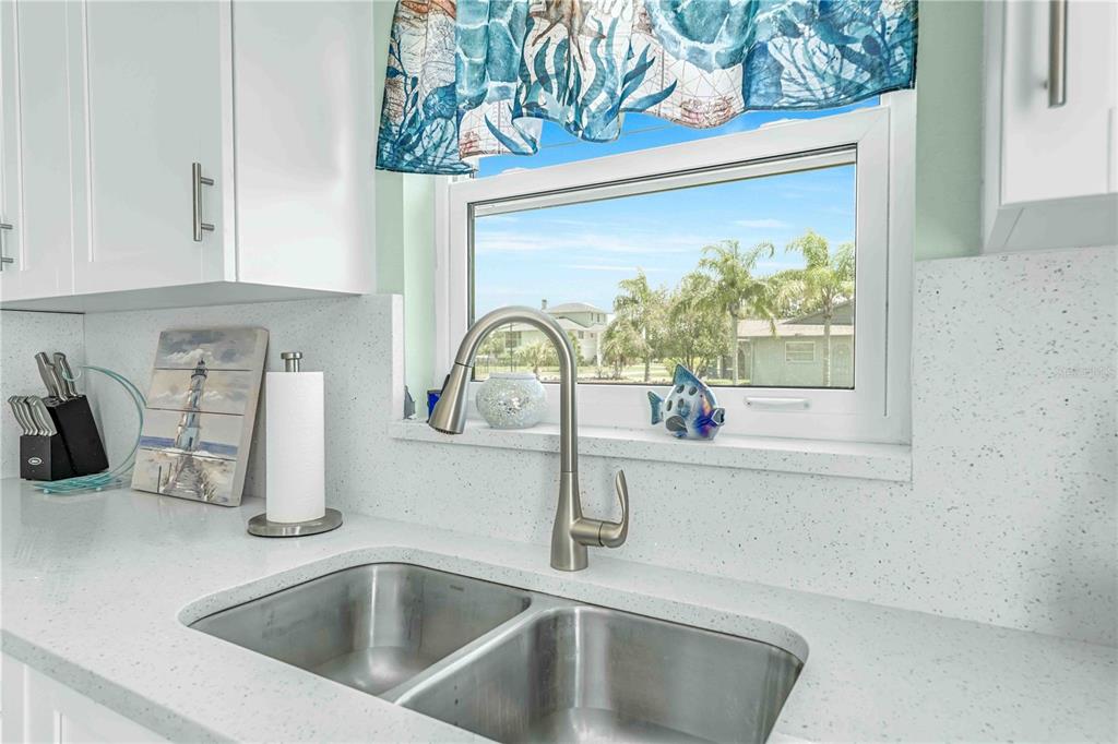 3379 Crape Myrtle Drive Hernando Beach, FL 34607 - Photo 9 of 68 a kitchen with a sink and a window