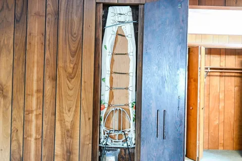 a room with a large bed and a window