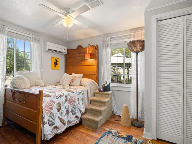 a bedroom with bed and window