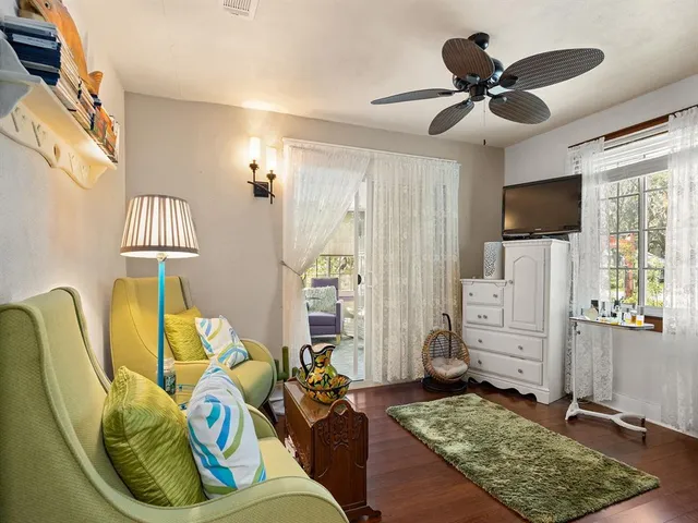a living room with furniture and a rug