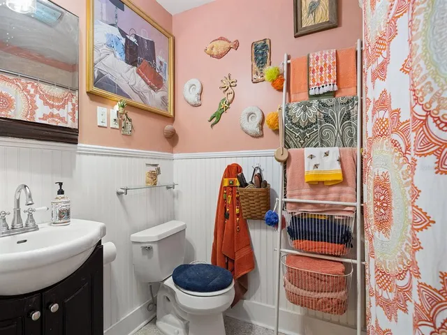 a bathroom with a toilet and a sink