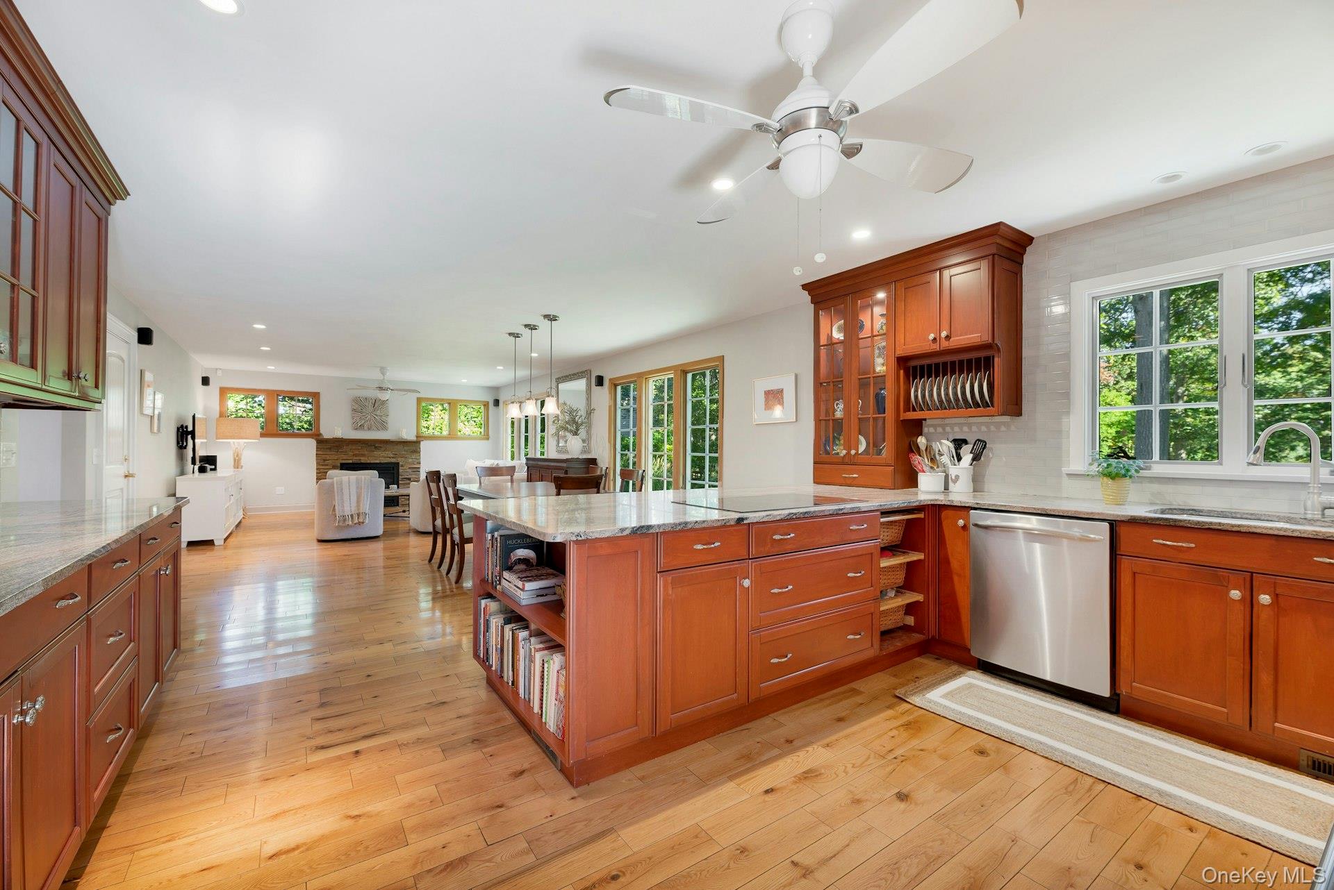 3600 Rocky Point Road East Marion, NY 11939 - Photo 43 of 44 a kitchen with stainless steel appliances granite countertop a stove and cabinets