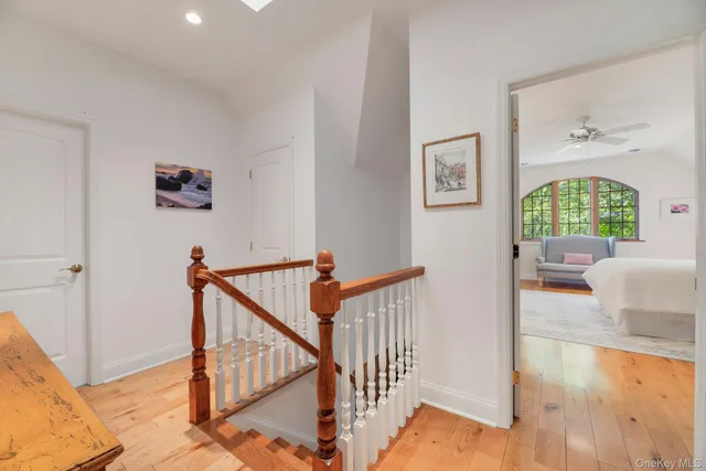 a view of an entryway with wooden floor and windows