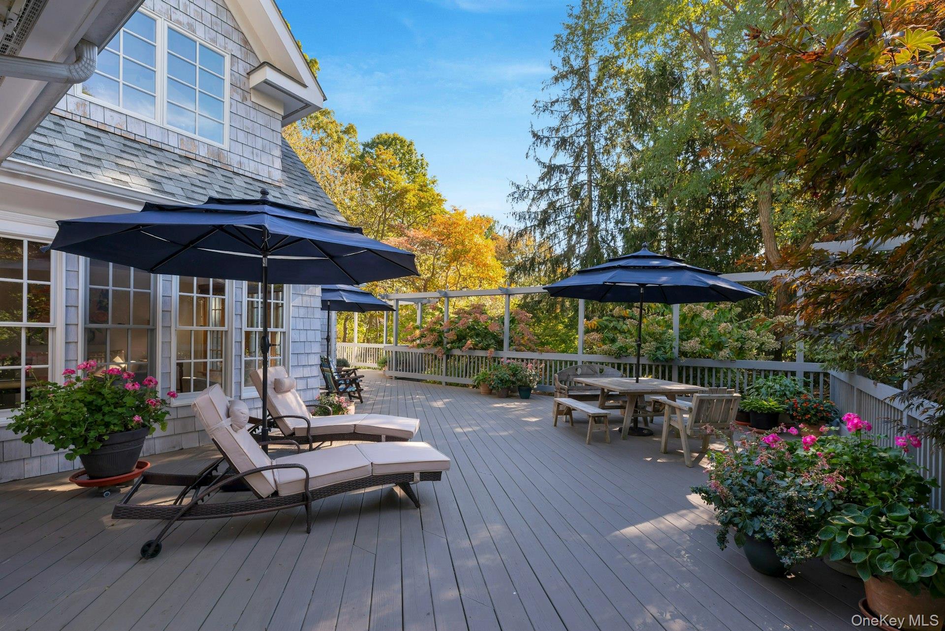 3600 Rocky Point Road East Marion, NY 11939 - Photo 29 of 45 a view of a patio with furniture and umbrella