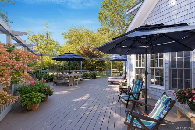 a view of a backyard with sitting area and furniture