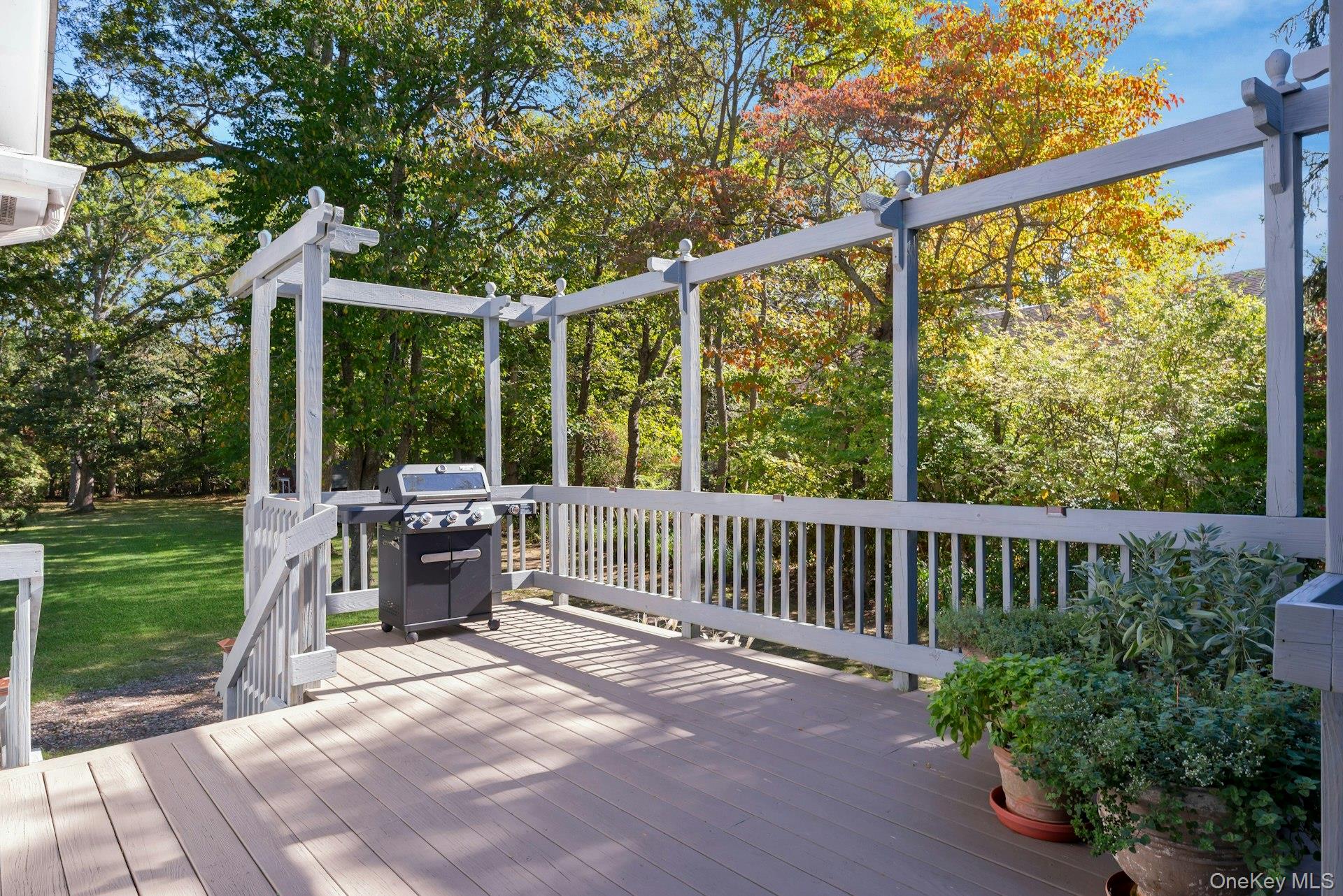 3600 Rocky Point Road East Marion, NY 11939 - Photo 33 of 44 a view of backyard with couches under an umbrella