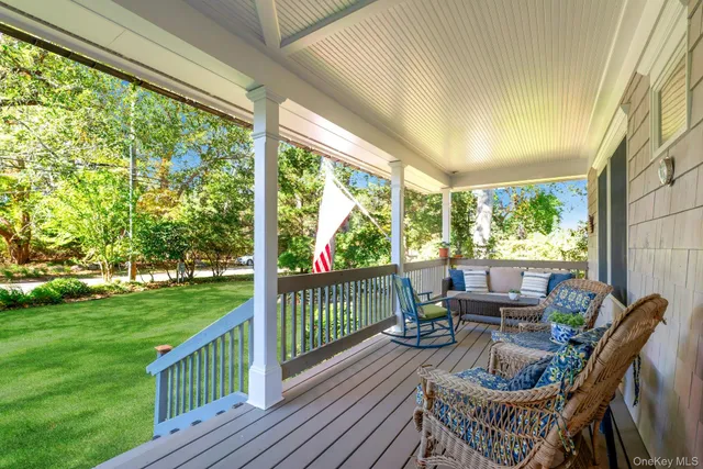 a view of balcony with furniture and garden