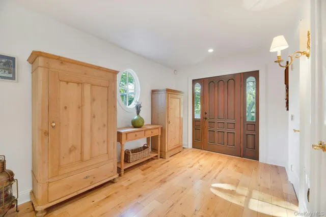 a view of a bedroom with closet and cabinet