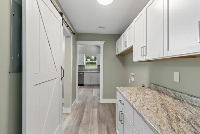a view of a kitchen cabinets and wooden floor