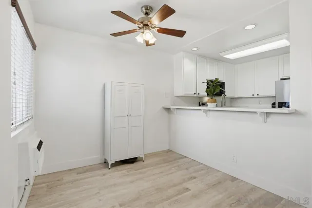 a view of kitchen with granite countertop cabinets a sink and appliances