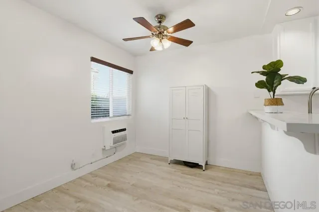 a view of an empty room with a window