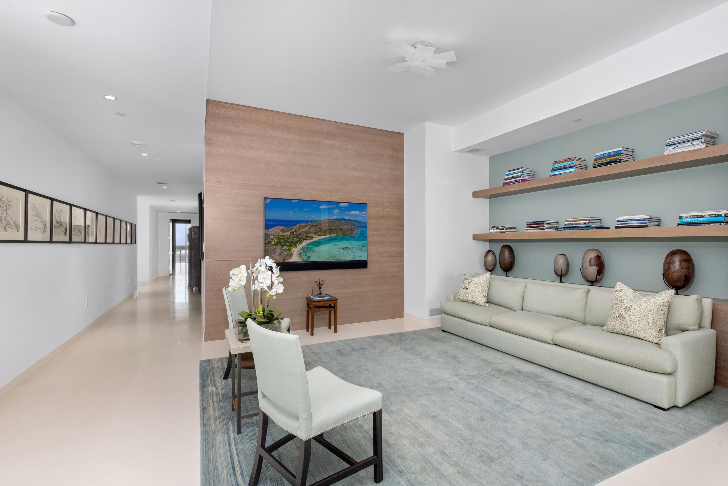 1000 South Ocean Boulevard, Unit 601 Boca Raton, FL 33432 - Photo 17 of 54 a living room with furniture and a flat screen tv