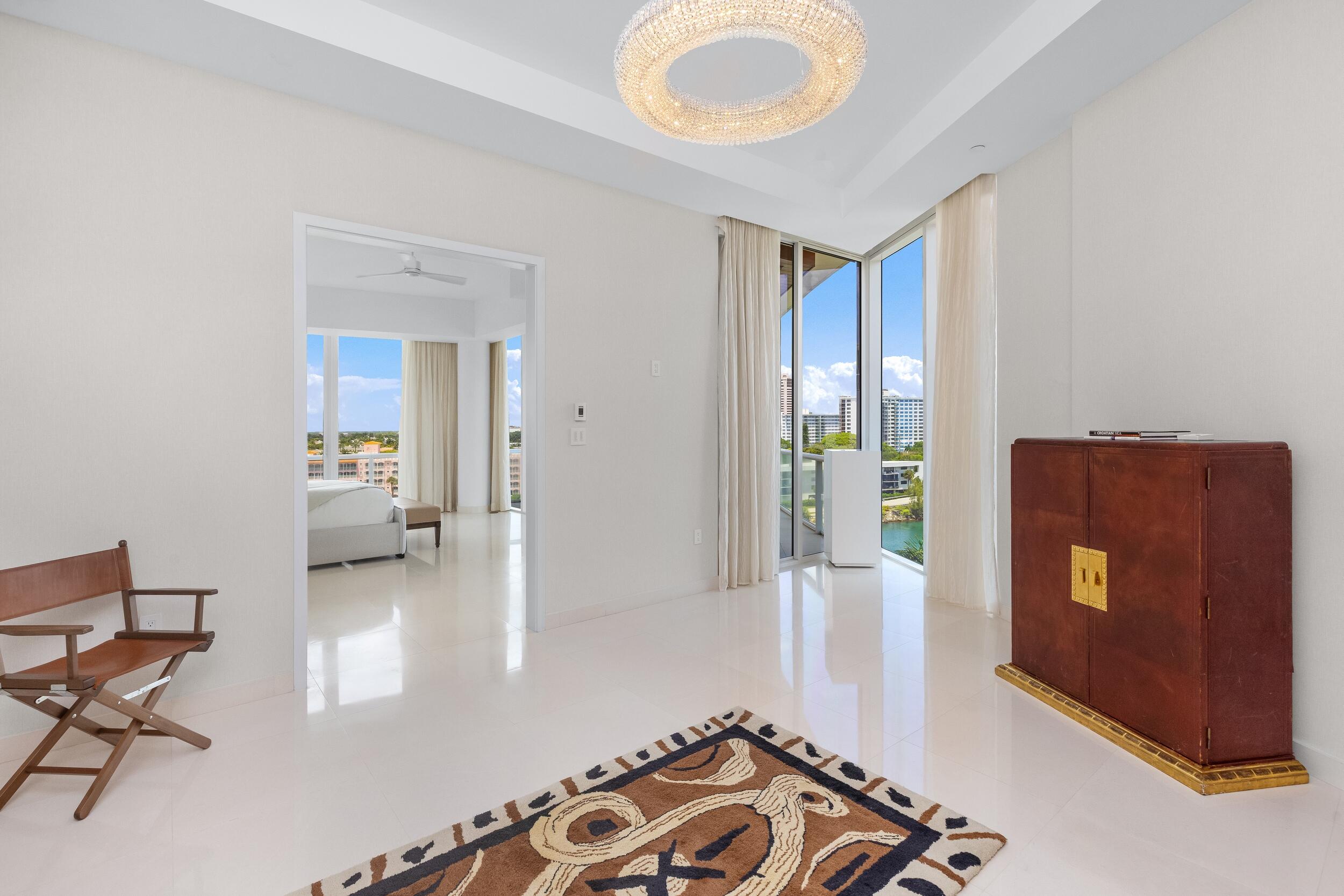 1000 South Ocean Boulevard, Unit 601 Boca Raton, FL 33432 - Photo 20 of 54 a bedroom with furniture and a gate