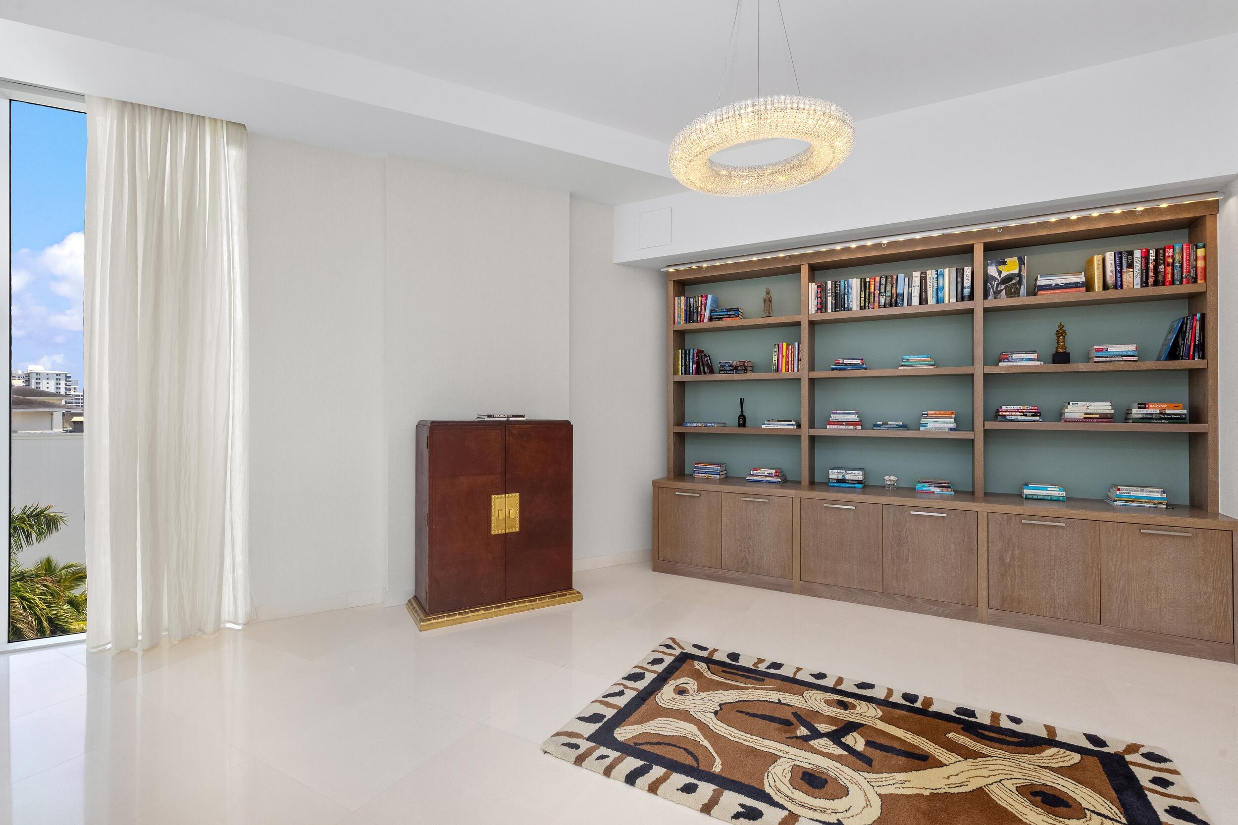 1000 South Ocean Boulevard, Unit 601 Boca Raton, FL 33432 - Photo 21 of 54 a living room with a couch and a bookshelf