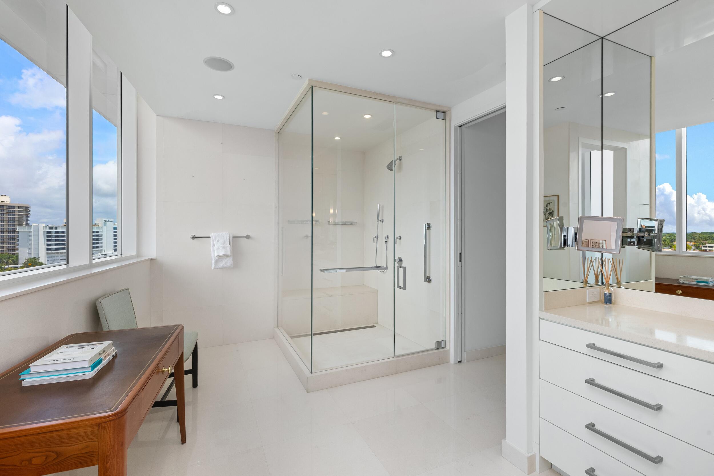 1000 South Ocean Boulevard, Unit 601 Boca Raton, FL 33432 - Photo 24 of 54 a bathroom with a granite countertop sink mirror and shower