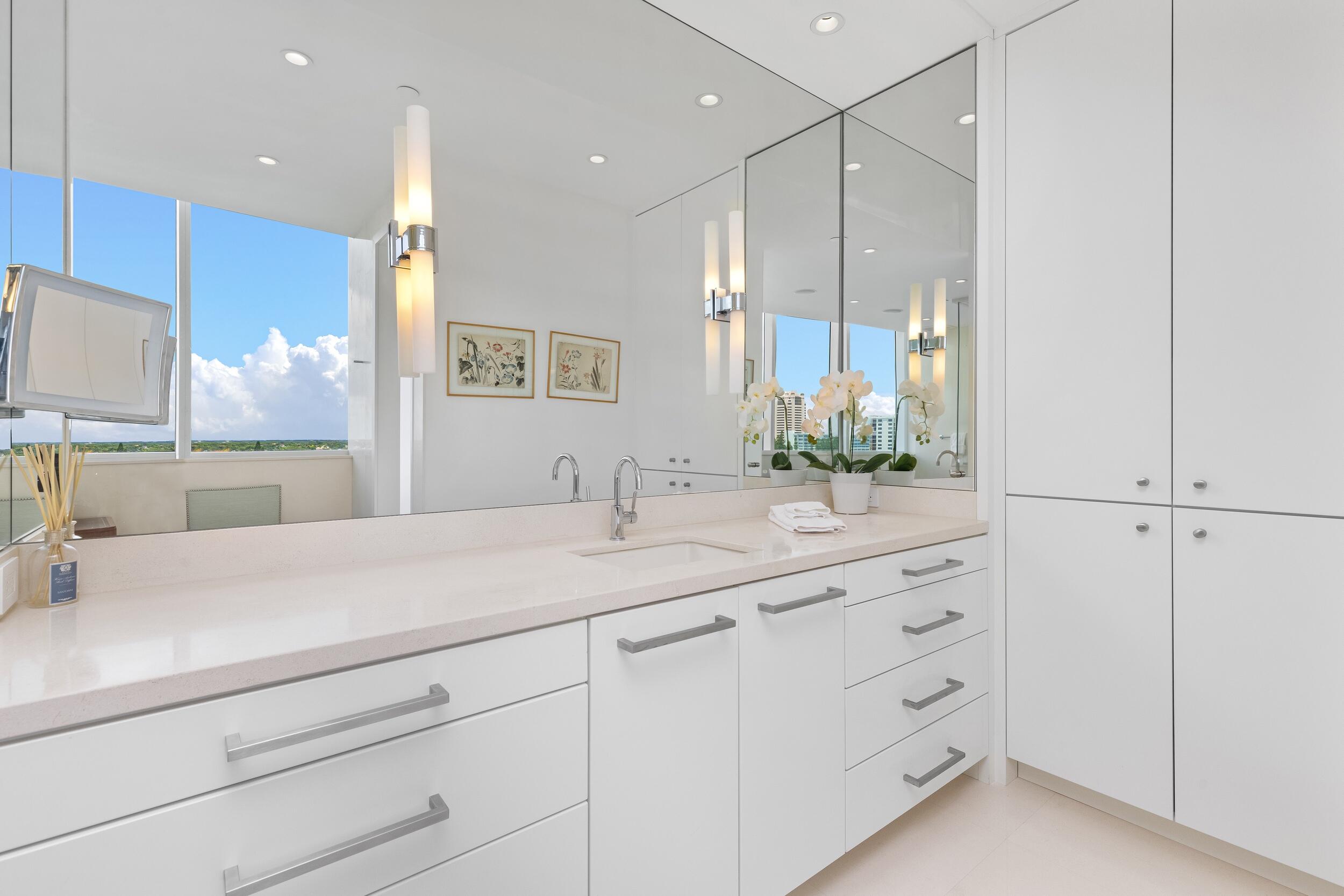 1000 South Ocean Boulevard, Unit 601 Boca Raton, FL 33432 - Photo 25 of 54 a bathroom with a sink double vanity and a mirror