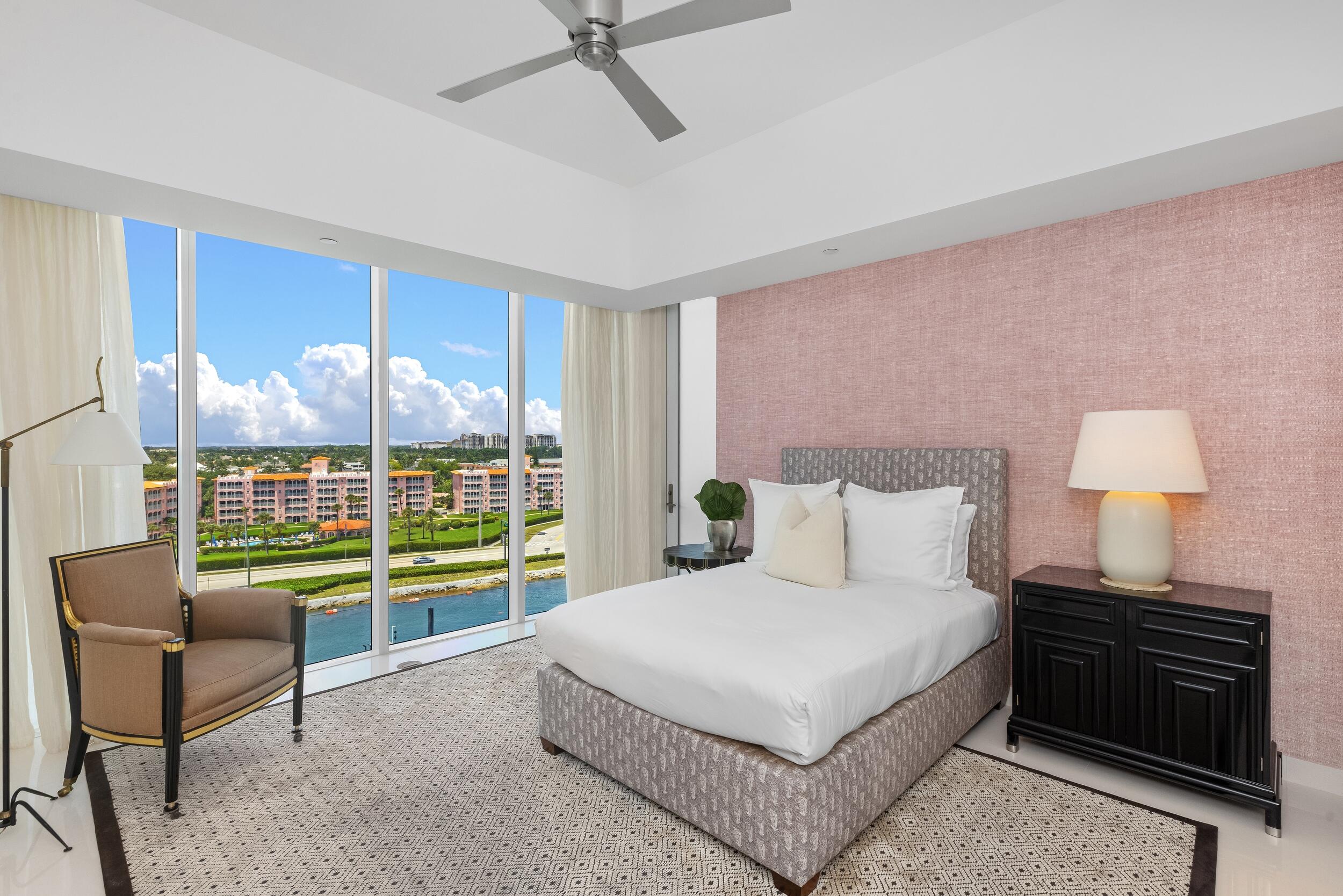 1000 South Ocean Boulevard, Unit 601 Boca Raton, FL 33432 - Photo 29 of 54 a bedroom with a large bed and a lamp next to a window