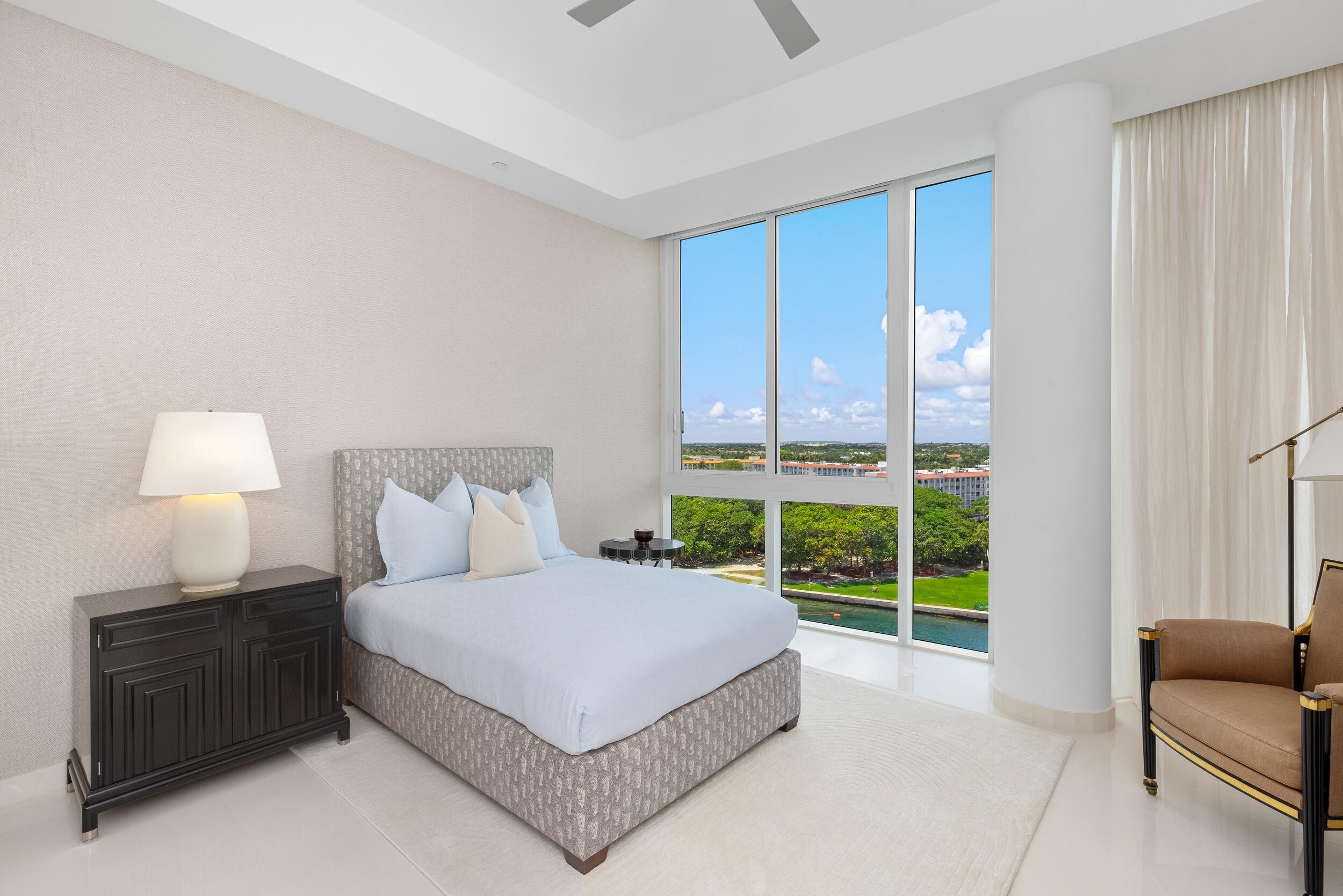 1000 South Ocean Boulevard, Unit 601 Boca Raton, FL 33432 - Photo 33 of 54 a spacious bedroom with a bed and a couch