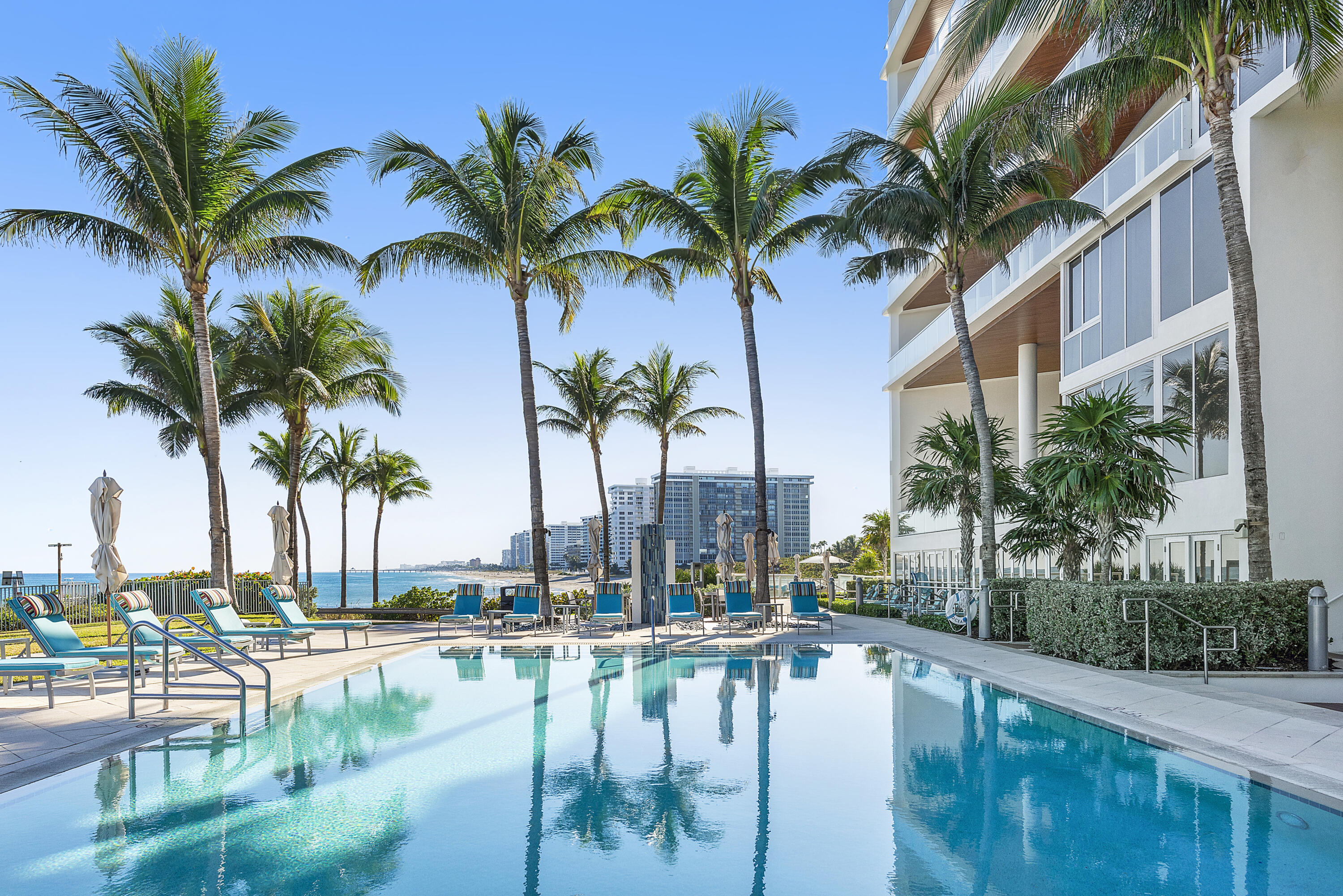 1000 South Ocean Boulevard, Unit 601 Boca Raton, FL 33432 - Photo 43 of 54 a view of swimming pool with a table and chairs