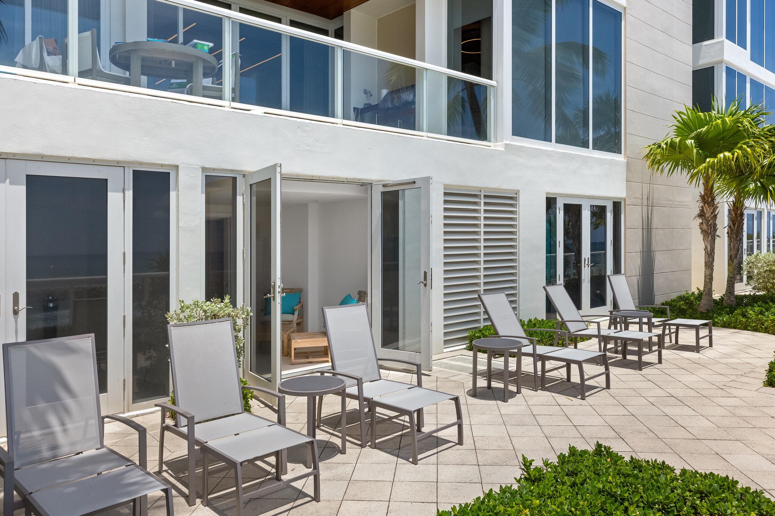 1000 South Ocean Boulevard, Unit 601 Boca Raton, FL 33432 - Photo 45 of 54 a building outdoor space with patio furniture and potted plants