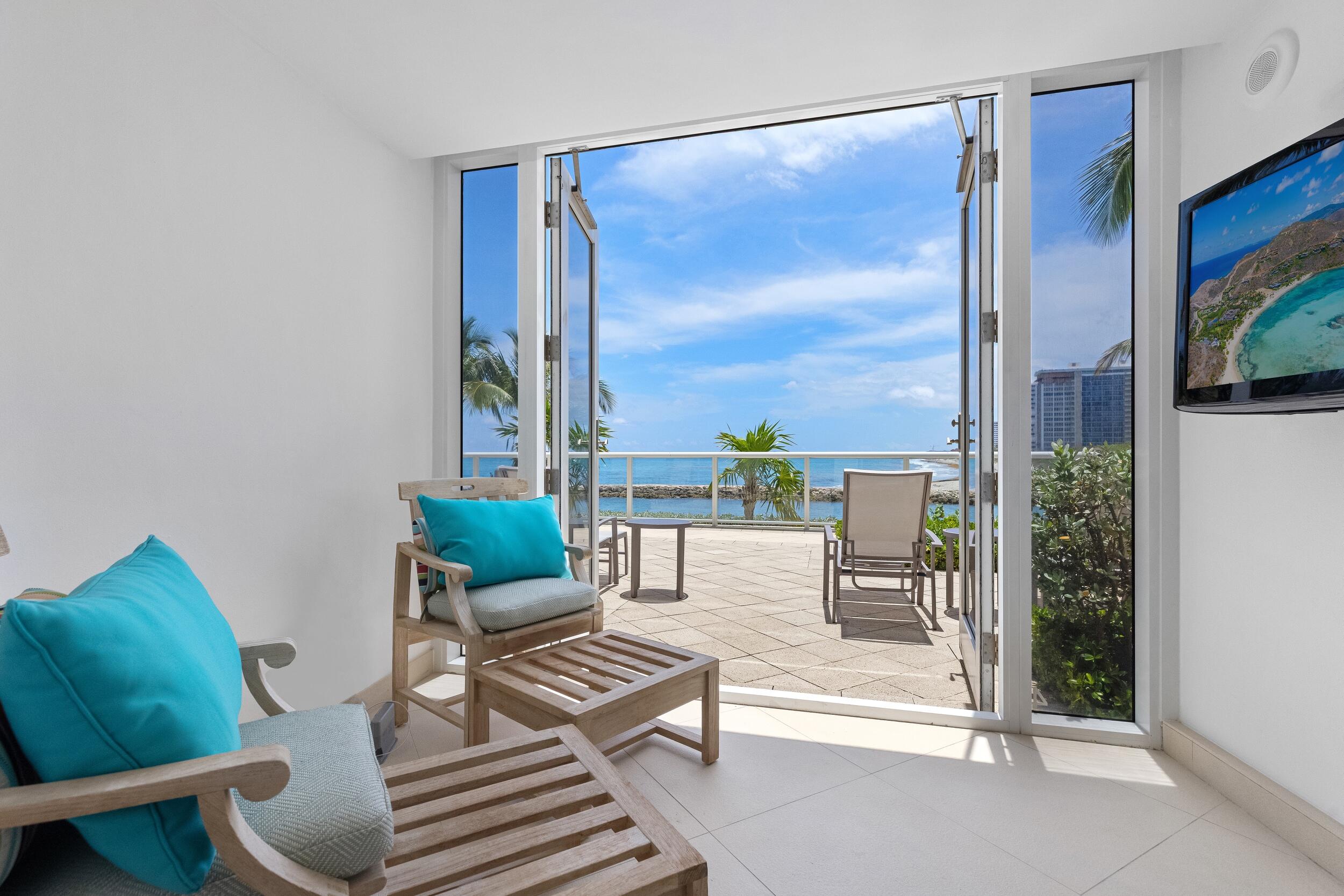 1000 South Ocean Boulevard, Unit 601 Boca Raton, FL 33432 - Photo 46 of 54 a living room with furniture and a floor to ceiling window