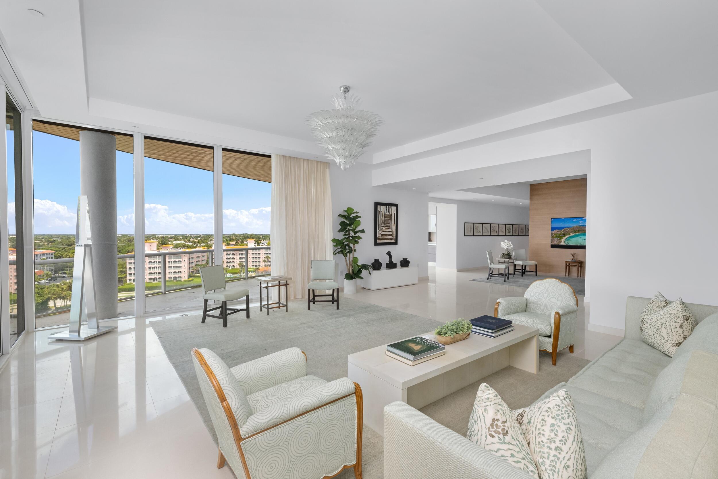 1000 South Ocean Boulevard, Unit 601 Boca Raton, FL 33432 - Photo 8 of 54 a living room with furniture and large windows