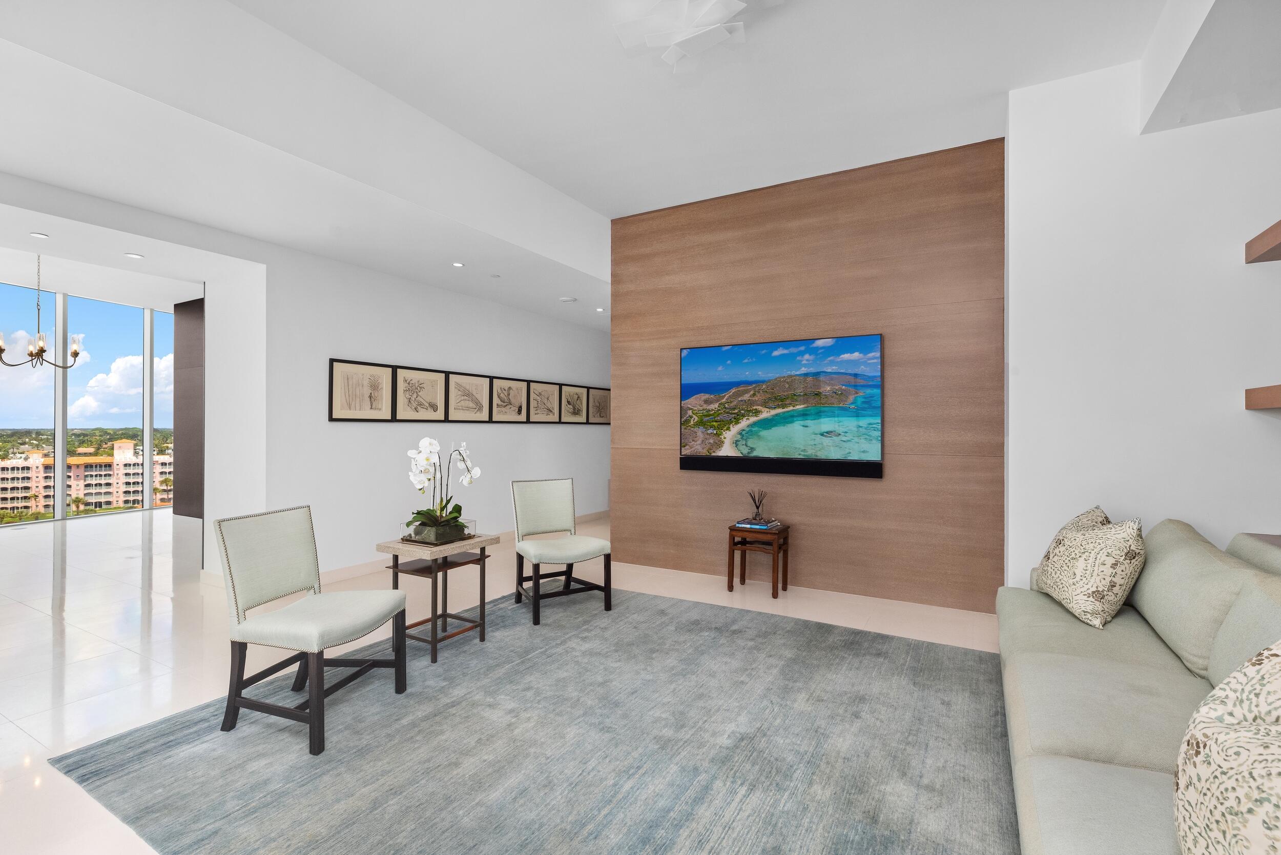 1000 South Ocean Boulevard, Unit 601 Boca Raton, FL 33432 - Photo 10 of 54 a living room with furniture and a flat screen tv