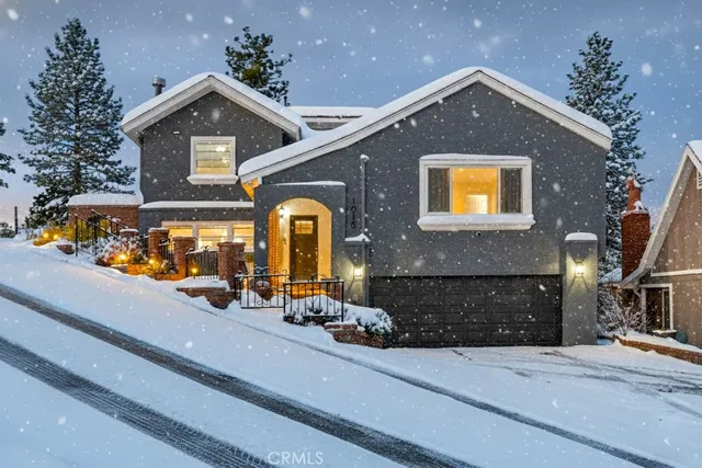 a kitchen with a white cabinets and chairs