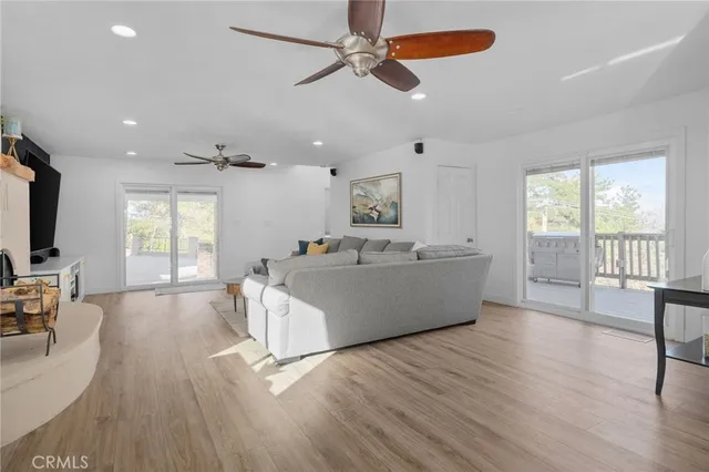 a large bedroom with a bed and a flat screen tv