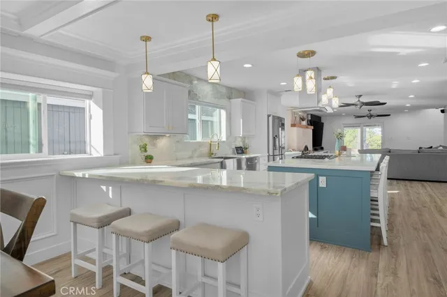 a kitchen that has a sink and a stove