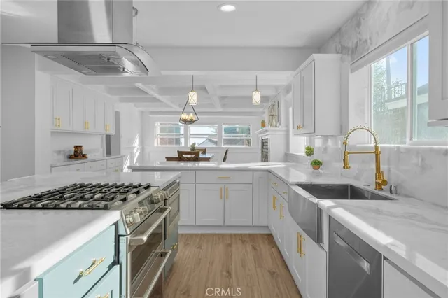 a view of a storage & utility room with closet wooden floor and windows