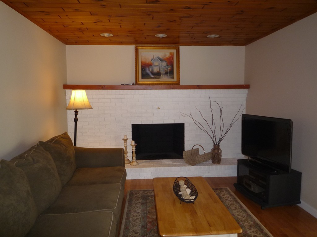 100 Highcrest Road Fall River, MA 02720 - Photo 12 of 30 a living room with furniture and a flat screen tv