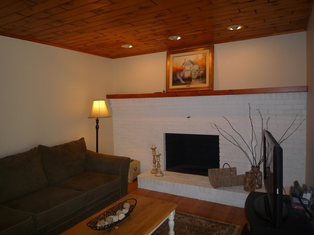 100 Highcrest Road Fall River, MA 02720 - Photo 13 of 30 a living room with furniture and a fireplace