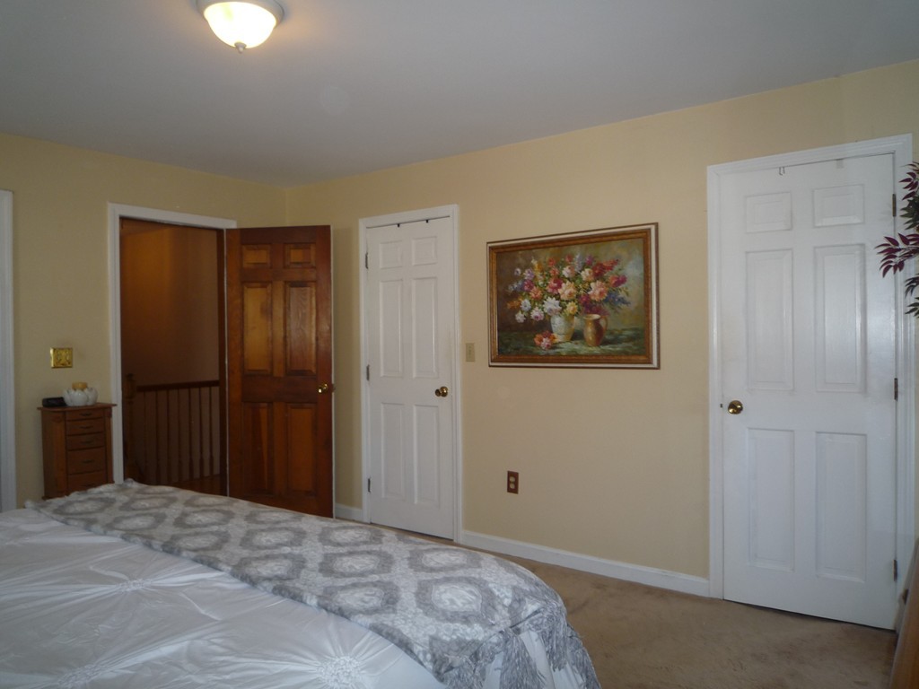 100 Highcrest Road Fall River, MA 02720 - Photo 20 of 30 a bedroom with a bed and a lamp on dresser
