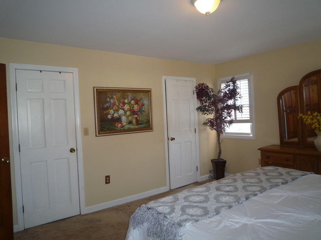 100 Highcrest Road Fall River, MA 02720 - Photo 21 of 30 a bedroom with a bed and a painting on the wall