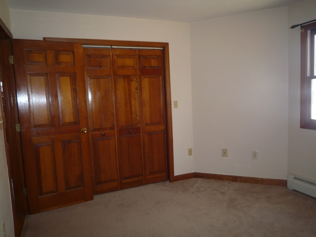 100 Highcrest Road Fall River, MA 02720 - Photo 26 of 30 an empty room with a wooden door