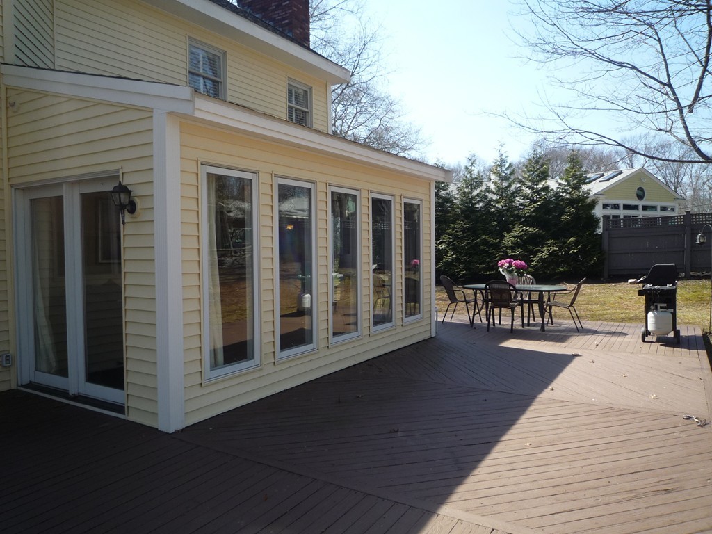 100 Highcrest Road Fall River, MA 02720 - Photo 30 of 30 a view of a patio with table and chairs and floor to ceiling window