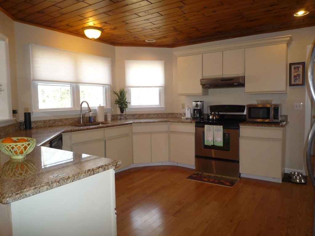 100 Highcrest Road Fall River, MA 02720 - Photo 3 of 30 a kitchen with stainless steel appliances granite countertop a sink stove and refrigerator