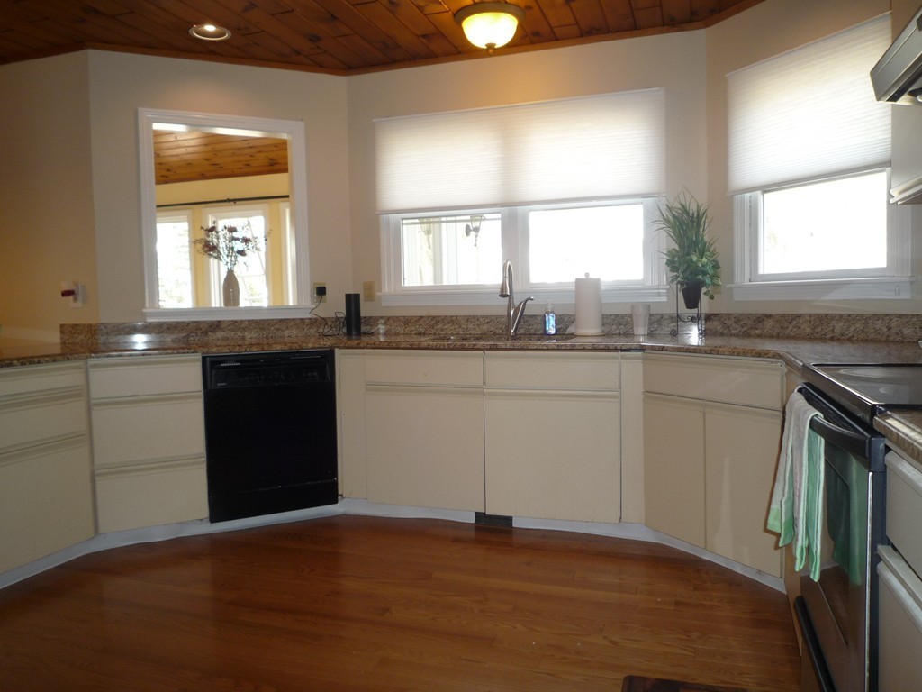 100 Highcrest Road Fall River, MA 02720 - Photo 4 of 30 a kitchen with granite countertop a sink window and cabinets