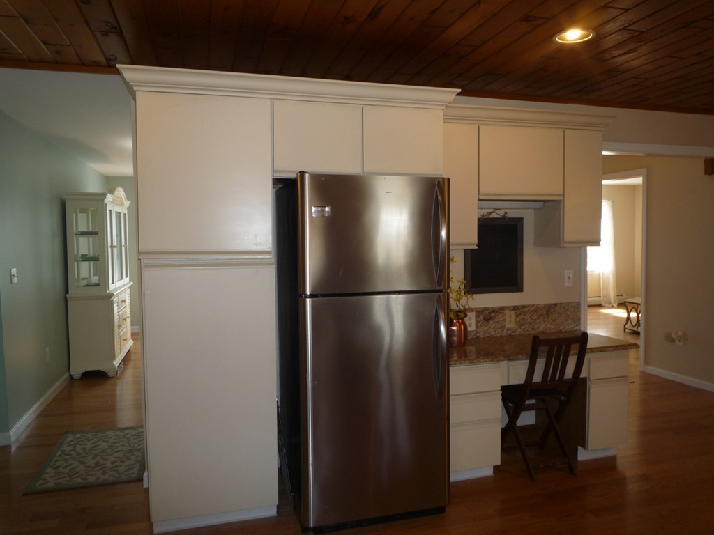 100 Highcrest Road Fall River, MA 02720 - Photo 6 of 30 a metallic refrigerator freezer sitting in a kitchen